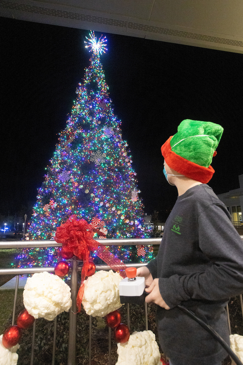 This year, 11-year-old Kyler Hall, who has been a patient at Children’s & Women’s Hospital for the past five months, had the honor of flipping the switch, illuminating the more than 350,000 lights on the tree at the ceremony.
