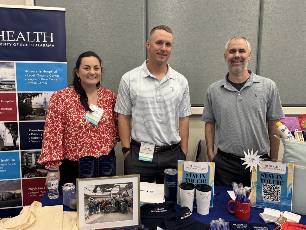 Haley Marchman, MSN, CRNA, chief CRNA at Providence Hospital; James “Bill McRae, DNAP, CRNA, chief CRNA at University Hospital; and Jason Reed, MSN, MNA, CRNA, chief CRNA at Children’s & Women’s Hospital; man a recruiting table at the Alabama Association of Nurse Anesthetists. Not pictured: Meredith Perry, DNAP, CRNA.
