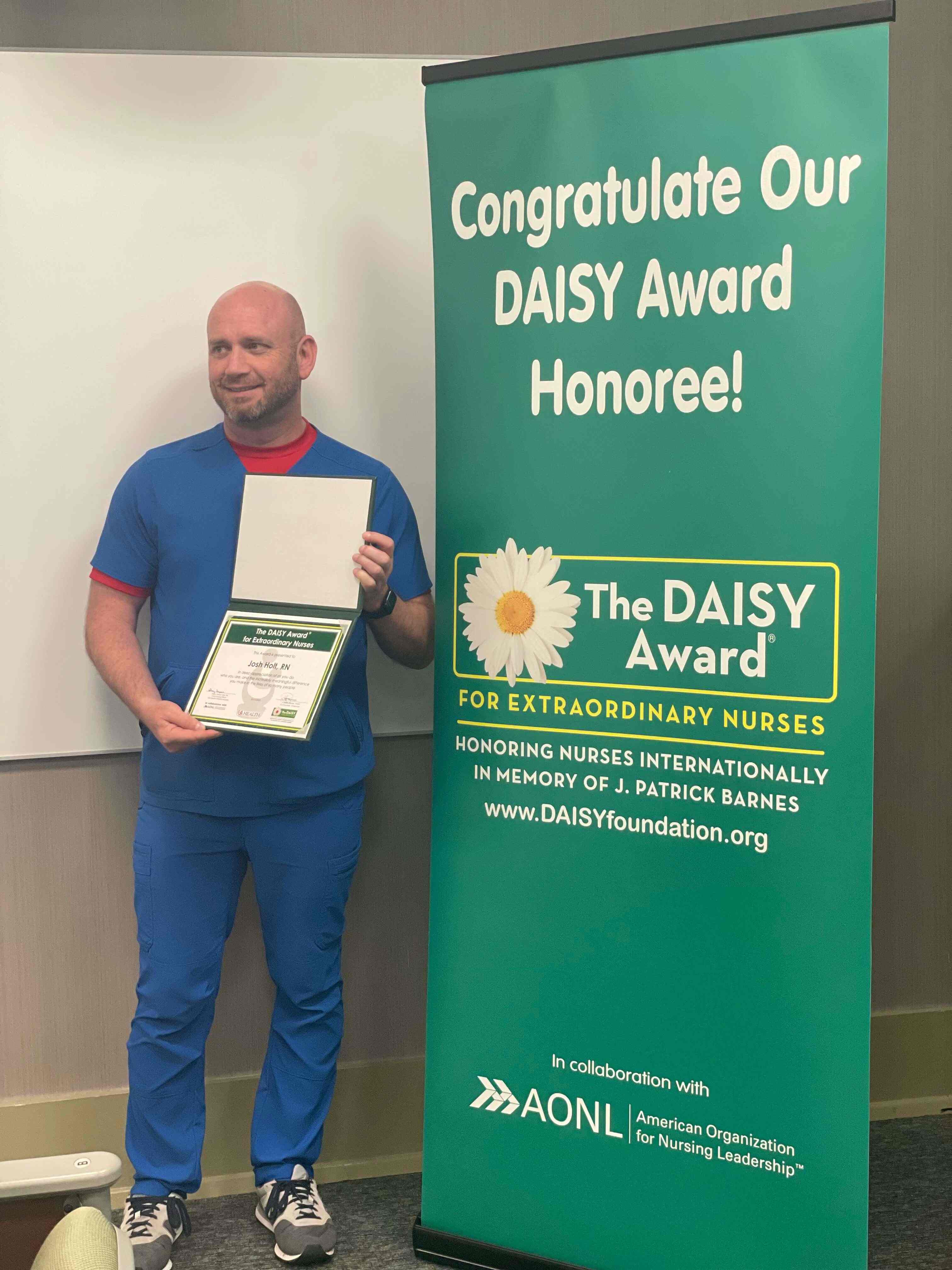 Josh Holt, R.N., a nurse in the intensive care unit, won a DAISY Award.