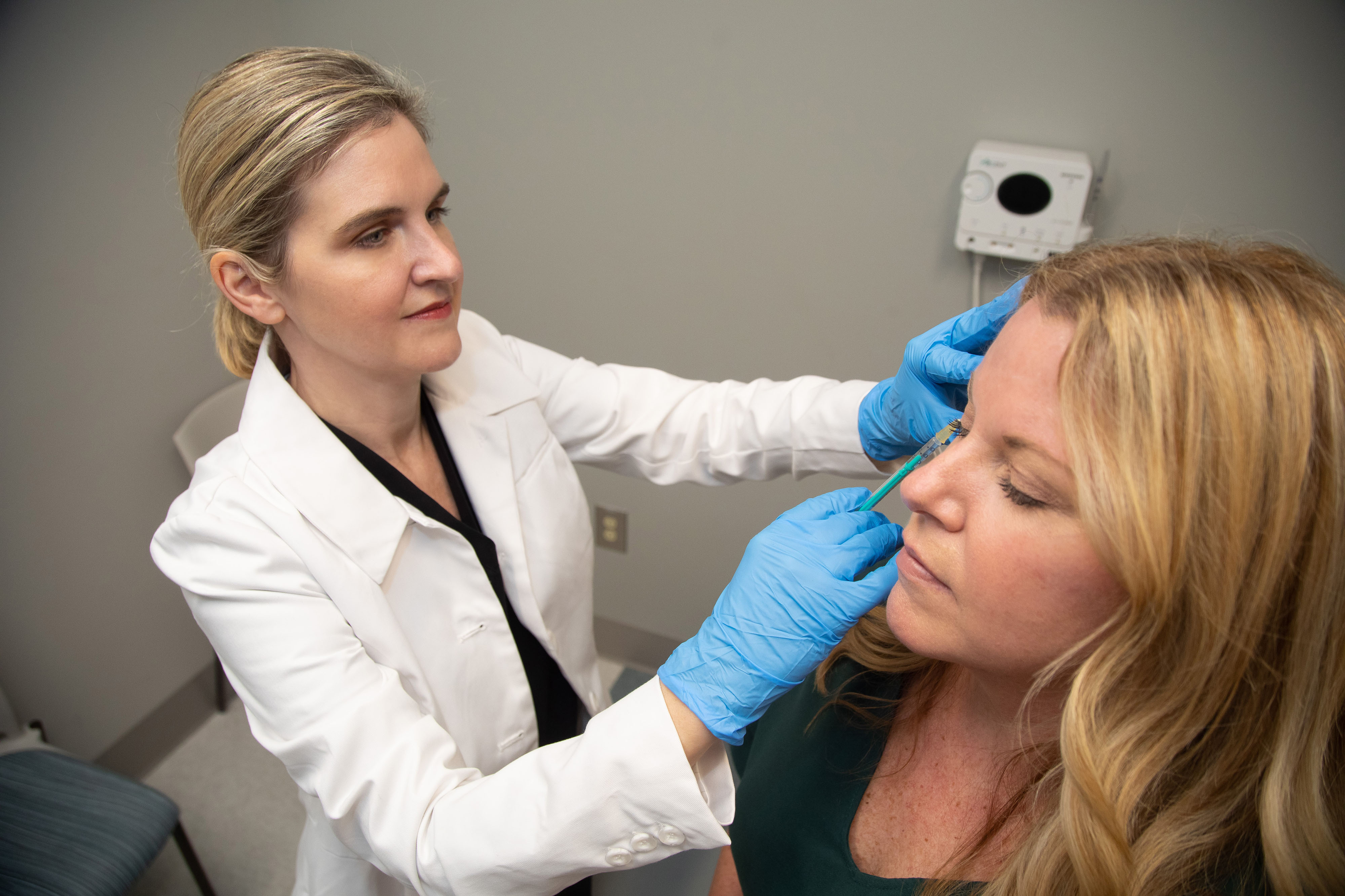 Dr. Kimberly Donnellan performs a procedure on a patient.