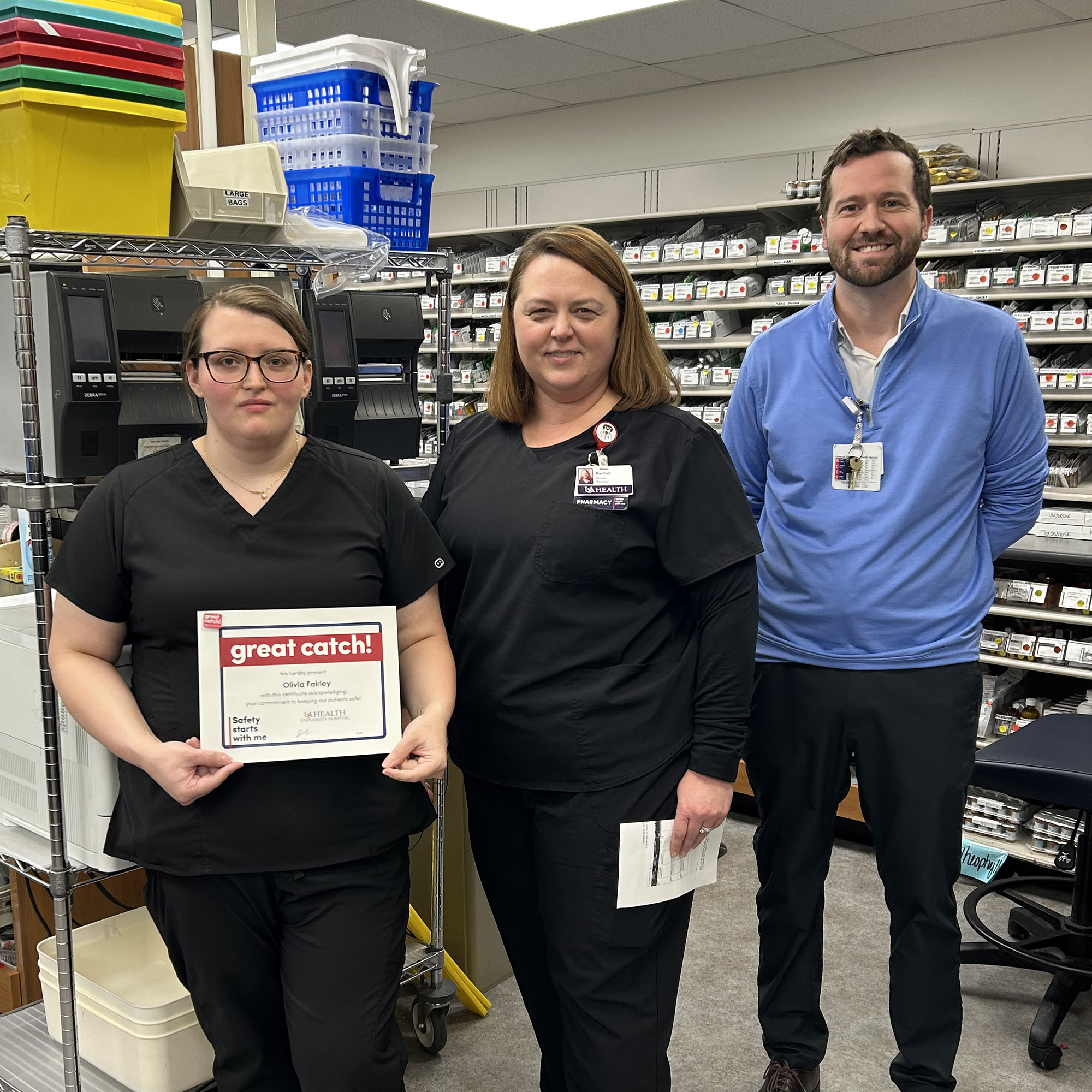 Olivia Fairley, pharmacist, holds her Great Catch Award.