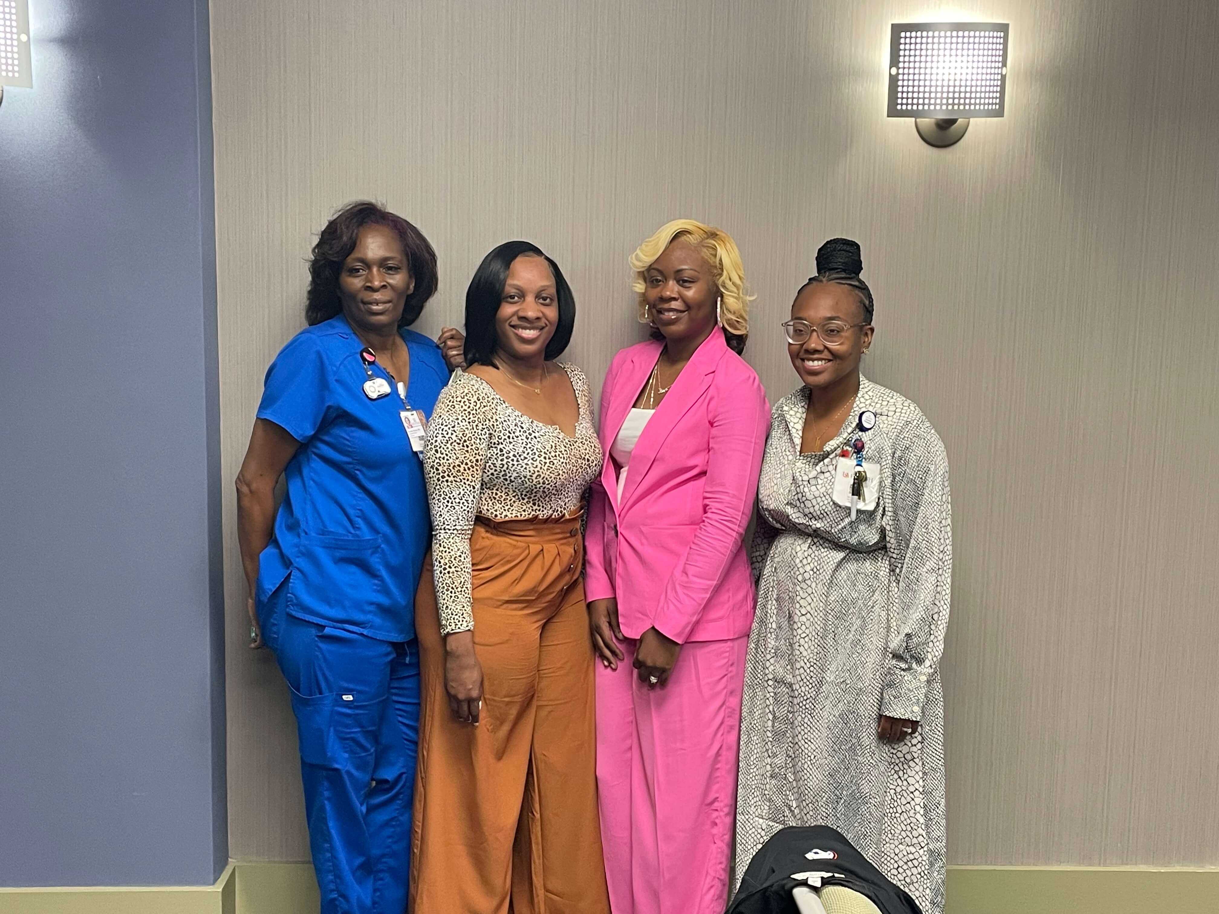 From left, DAISY Award nominees Alexis Baker, R.N., and Suzette Saucier, R.N., nurses on the 11th floor, stand with DAISY Award recipient Kyla Jackson, R.N., during a recent event honoring them. At right is Nurse Manager Jada Gardner, R.N.