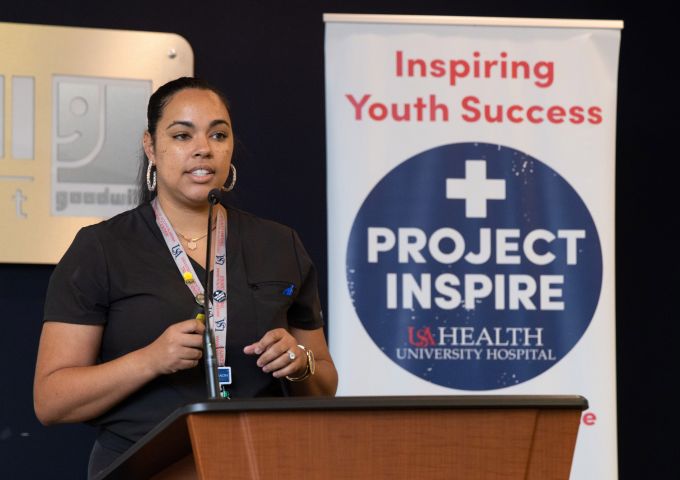 Ashley Williams Hogue, M.D., speaks at the graduation ceremony for the fourth class of Project Inspire.