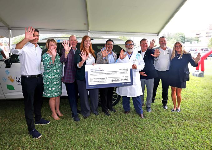 A giant check for $100,000 is presented by Hyundai Hope on Wheels.