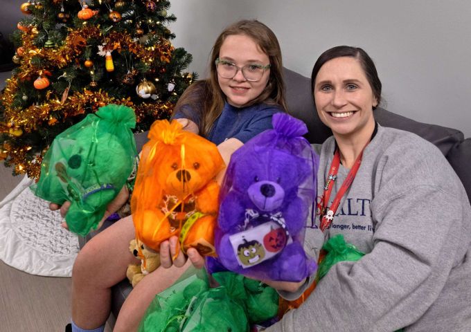 Young patient donates special-edition Higgy Bears to USA Health Complex Pediatric Spine Team for children with scoliosis