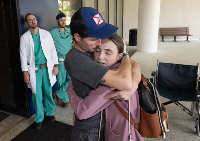 ECMO patient makes an emotional hospital exit after being discharged