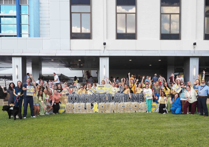 Children’s & Women’s Hospital marks Childhood Cancer Awareness Month with group photo at bell ringing ceremony