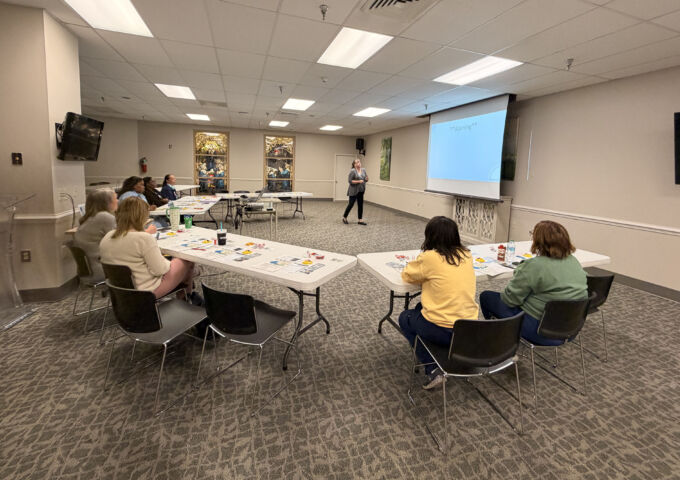 Attendees watch a presenter during a recent wellness session.