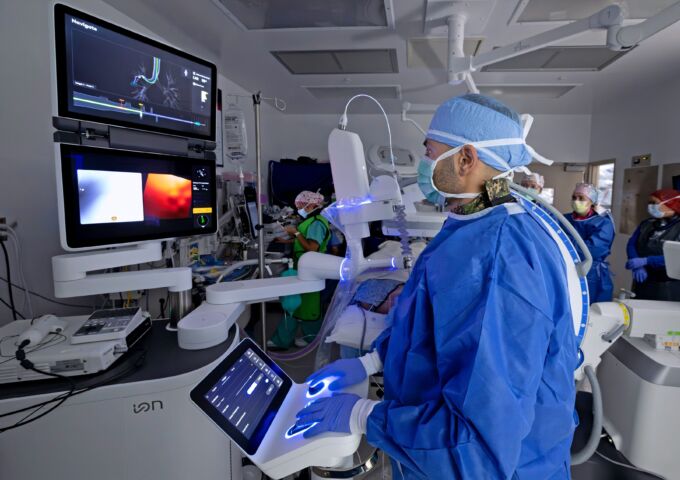 Physican performing robotic surgery