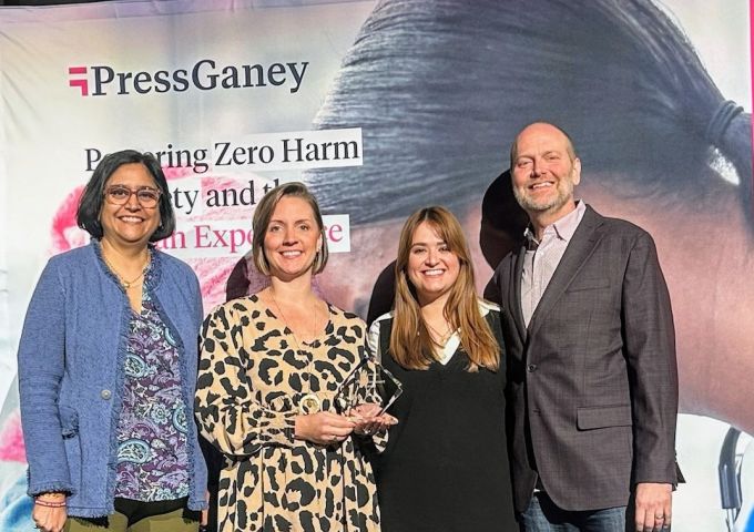 Jennifer Lovitte, second from left, patient safety coordinator for Children’s & Women’s Hospital, and Anna Blache, patient safety coordinator for University Hospital, accept the Serious Safety Event Rate Reduction Award from Press Ganey’s Tejal Gandhi, left, and Kerry Butler, right, at the HX24 Safety Summit in Orlando, Florida.
