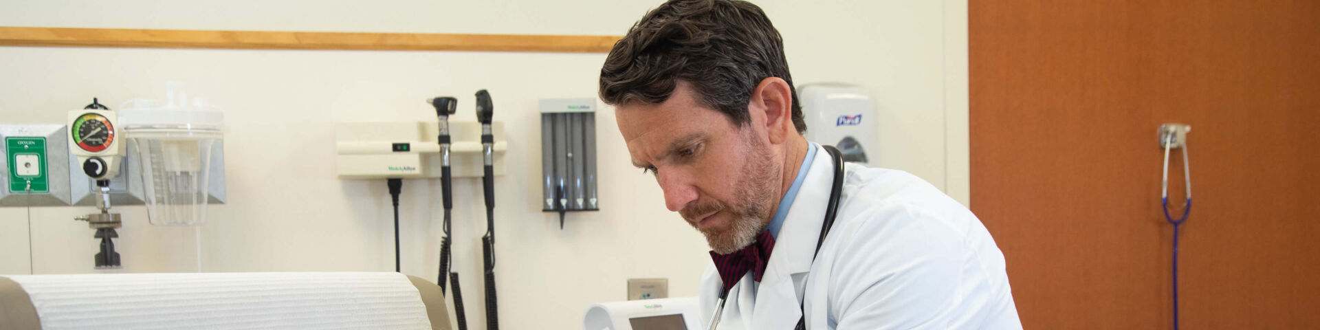 Dr. Joseph Jones examines patient
