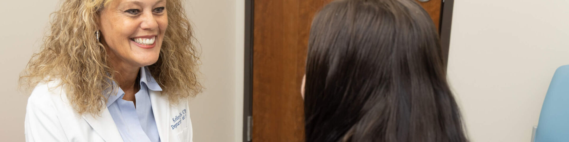 Kelley Day, CRNP speaks with patient