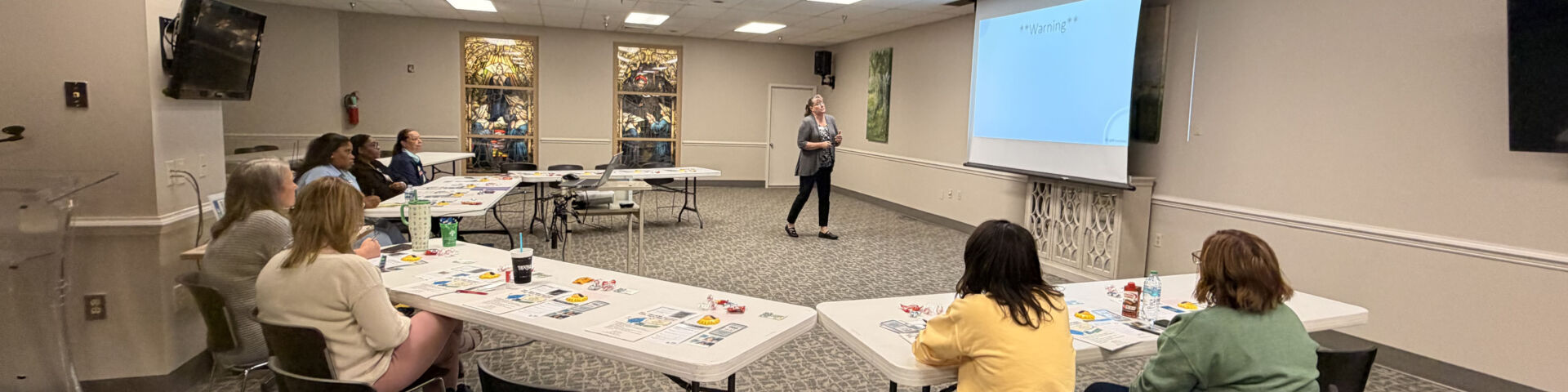 Attendees watch a presenter during a recent wellness session.