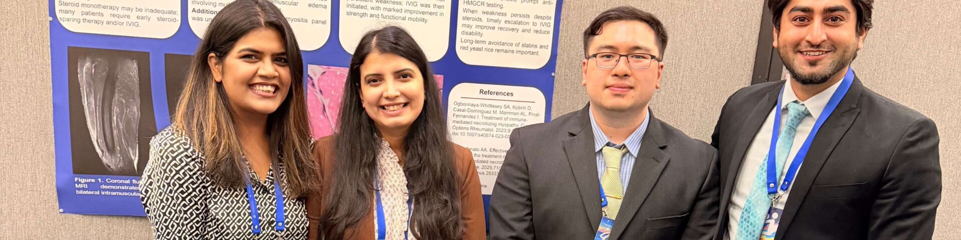 Resident physicians stand in front of poster