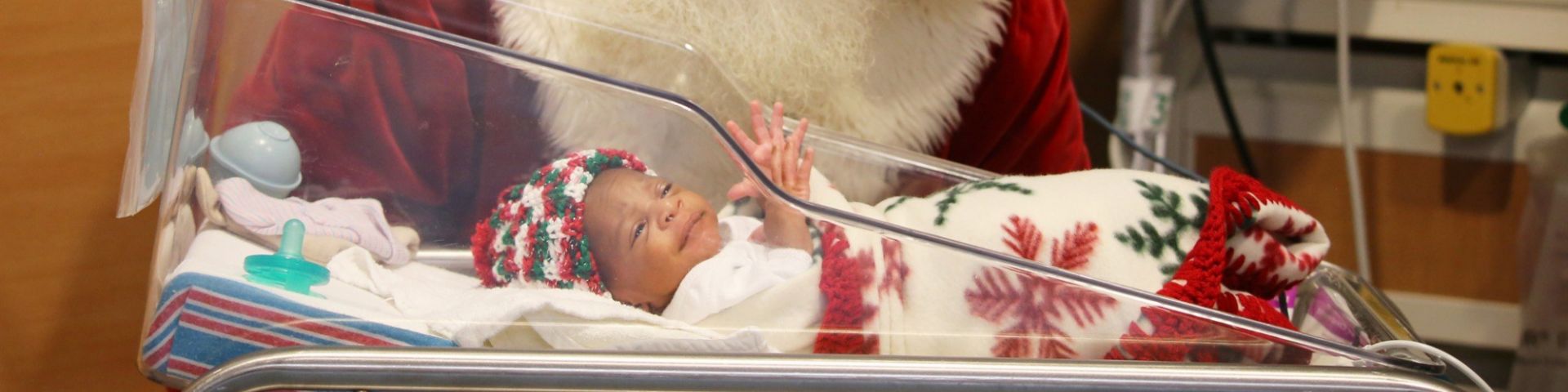 Families celebrate holidays with Santa photos in neonatal intensive care unit