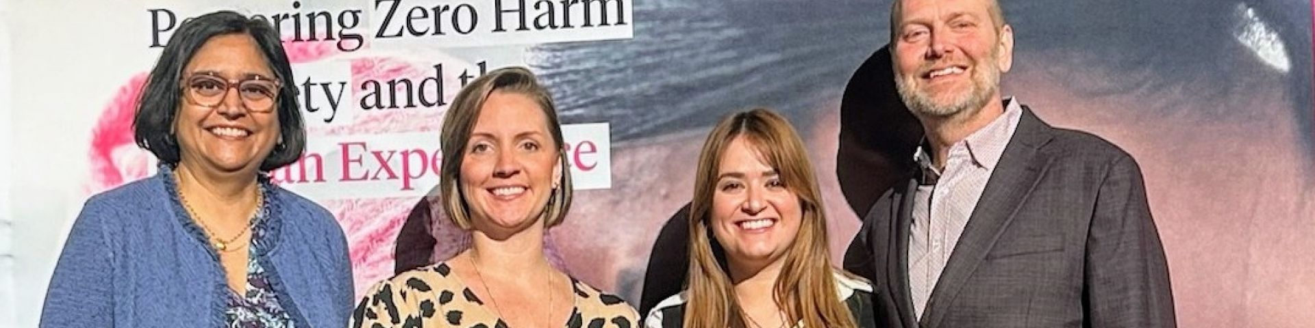Jennifer Lovitte, second from left, patient safety coordinator for Children’s & Women’s Hospital, and Anna Blache, patient safety coordinator for University Hospital, accept the Serious Safety Event Rate Reduction Award from Press Ganey’s Tejal Gandhi, left, and Kerry Butler, right, at the HX24 Safety Summit in Orlando, Florida.