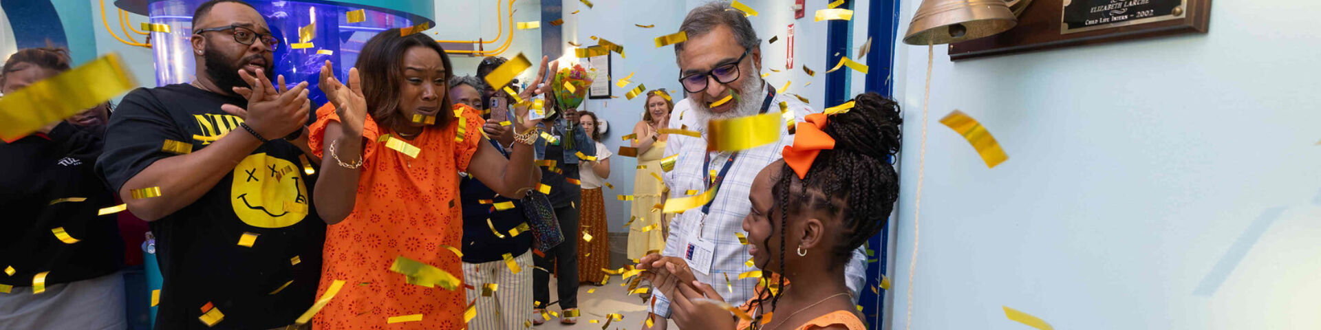 DeVyn Coker rang the bell inside the Hope infusion center to symbolize the completion of her treatment for cancer.