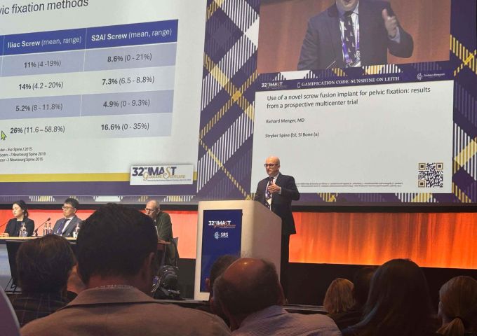 USA Health neurosurgeon presents a major research trial at spine conference in Scotland